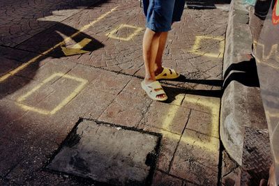 Low section of person on footpath