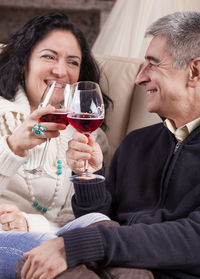 Happy friends sitting in a drinking glass