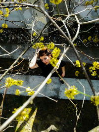 Young woman flowers on tree