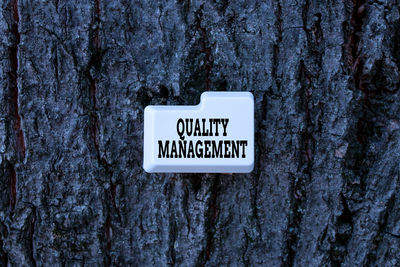 Information sign on tree trunk