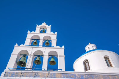 Low angle view of bell tower against sky