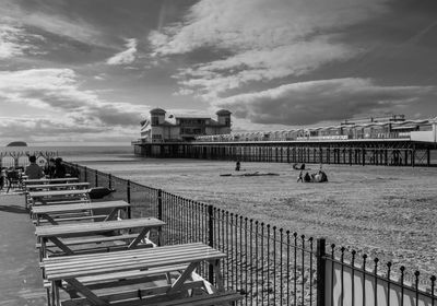 People on boat in city against sky