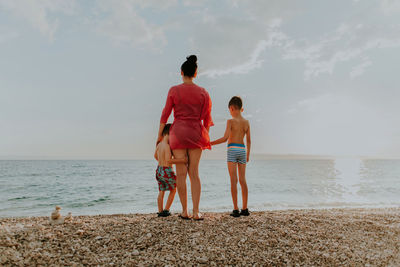 Family standing at beach