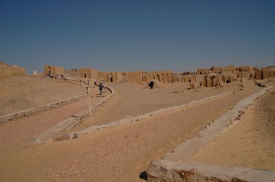 Scenic view of desert against clear sky