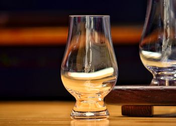 Close-up of beer glass on table
