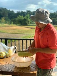 Man preparing food outdoors