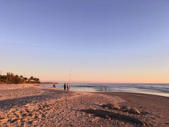 Scenic view of beach against clear sky