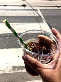 Close-up of hand holding drink