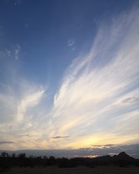 Low angle view of silhouette land against sky during sunset