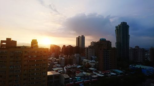 High angle view of buildings in city against sky