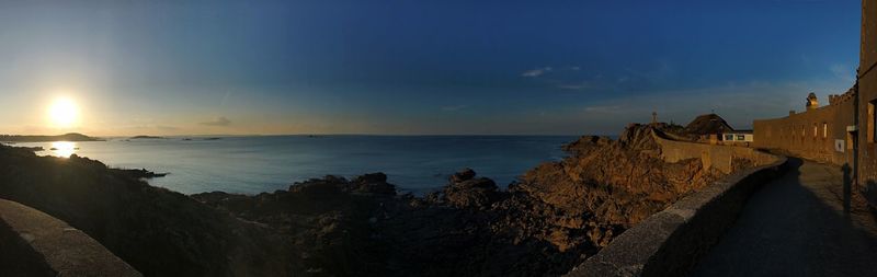 Panoramic view of sea against sky during sunset