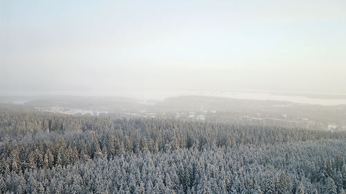 Scenic view of land against sky during winter