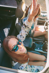 High angle view of friends traveling in car