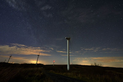 Low angle view of silhouette trees against sky at night