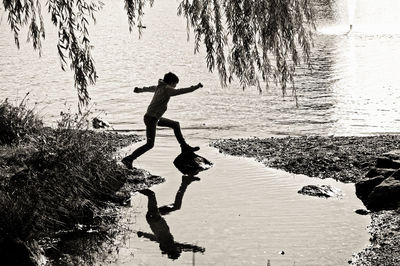 Silhouette of people in water