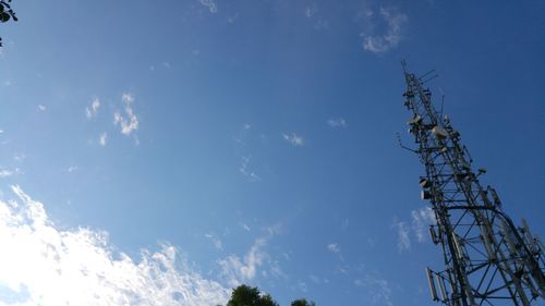 Low angle view of communications tower against sky