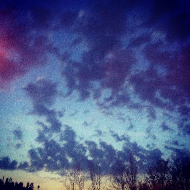 sky, beauty in nature, cloud - sky, tranquility, scenics, low angle view, tranquil scene, nature, blue, cloudy, idyllic, cloud, silhouette, dusk, tree, outdoors, weather, no people, dramatic sky, majestic