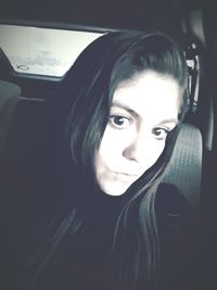 Portrait of woman in car