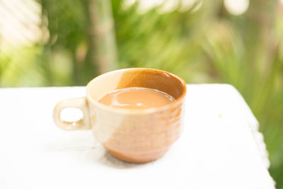 Close-up of coffee cup on table