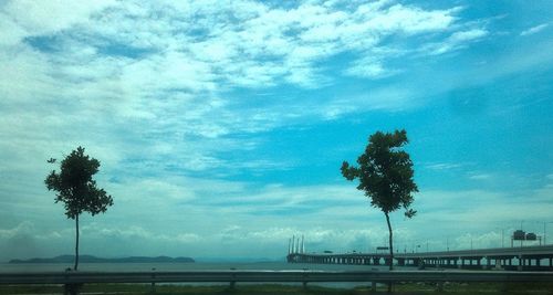 Scenic view of landscape against cloudy sky