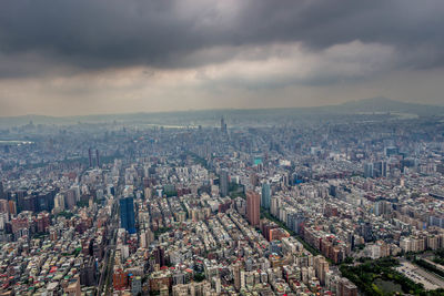 Aerial view of cityscape against sky