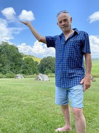 Full length of man standing on field