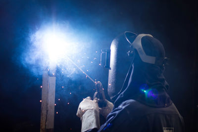 Man working on metal in workshop