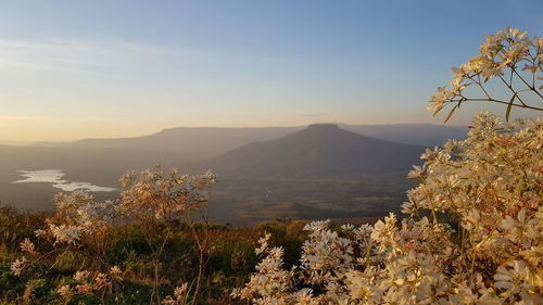 Scenic view of sea and mountains against sky