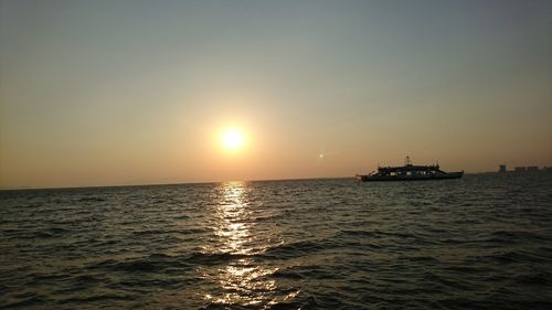 Scenic view of sea against sky at sunset