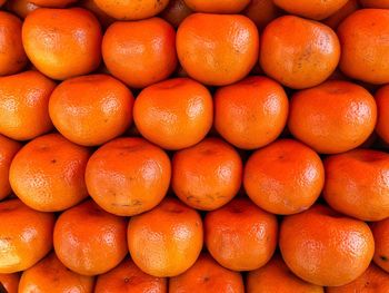 Full frame shot of oranges at market stall