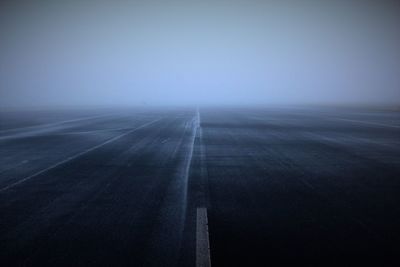 Empty road in foggy weather