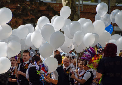 Group of people on balloons