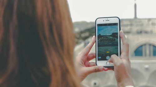 Close-up of woman using mobile phone