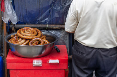 Man working on barbecue grill