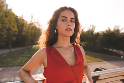 Portrait of beautiful young woman standing outdoors