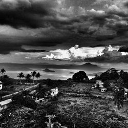 Scenic view of landscape against cloudy sky