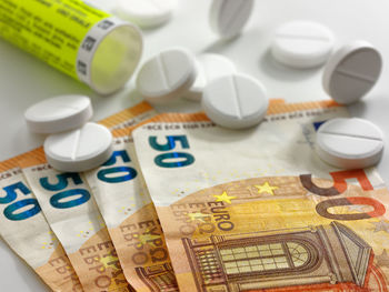 High angle view of coins on table