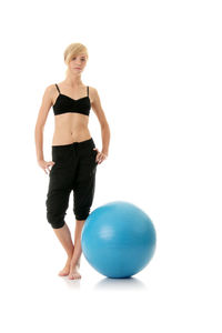 Full length of woman with ball in background
