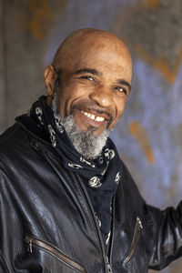 Portrait of smiling mature biker in leather jacket