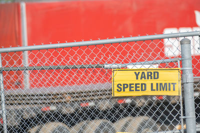 Text on chainlink fence