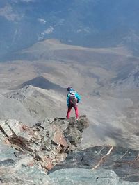 Woman standing on mountain