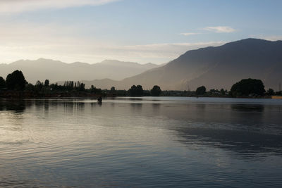 Scenic view of lake against sky during sunset