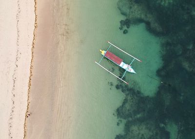 Aerial view of boat on sea against sky
