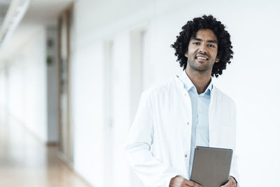 Portrait of young man using mobile phone