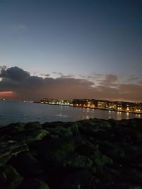 Scenic view of sea against sky at sunset