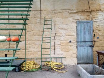 Ladder and ropes against building at royaumont abbey