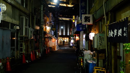 Illuminated walkway at night
