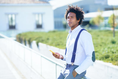 Portrait of young man standing outdoors