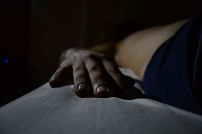 Woman relaxing on bed at home