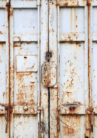 Full frame shot of locked old metallic door